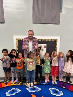 I3 KR Public Ed P2 Kyle Roggenkamp with preschool children.