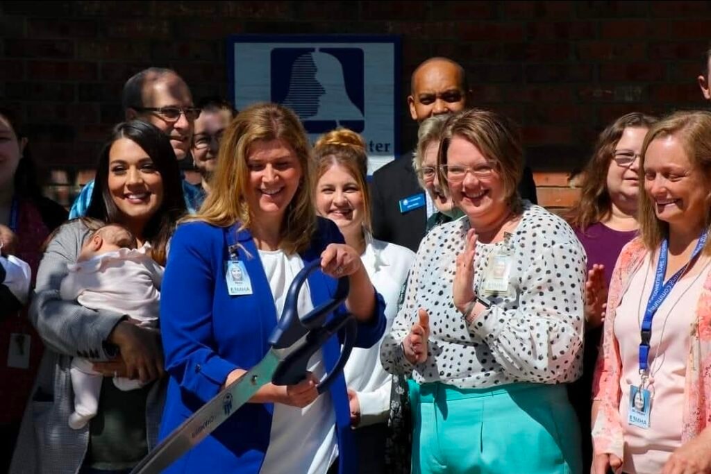 Sarah Lopez with her twins at a ribbon cutting for Sedgwick County Emergency Management