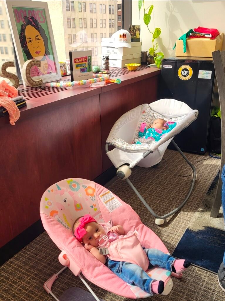 Sarah Lopez's two babies in rocking seats at her office