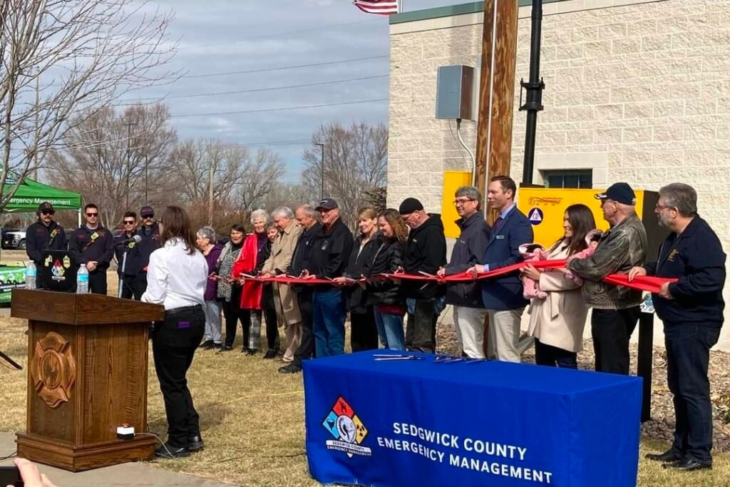 Sarah Lopez with her twins at a ribbon cutting for Sedgwick County Emergency Management